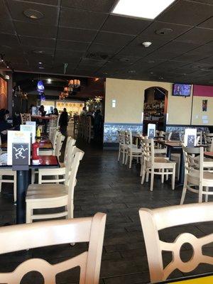 Dining area. Mostly clean though a few uncleared tables out of view.