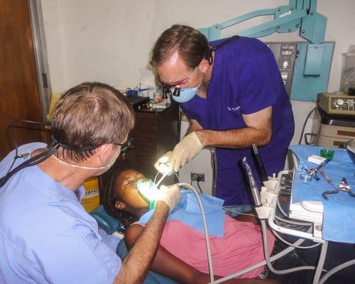 Drs. Tom (right) and Tracy Quickstad doing volunteer dentistry in Haiti, 2013.