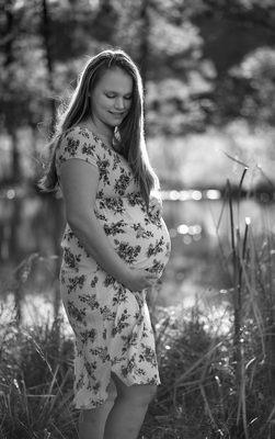 Black and white adding to the cherished loving mood this mother has for her coming baby.