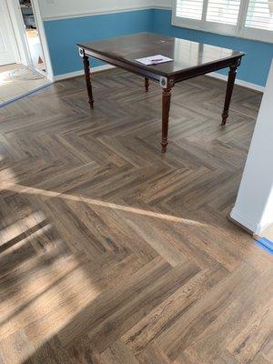 Harringbone pattern vinyl waterproof and life proof flooring.