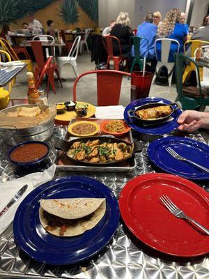 Beef taco (plain), beef enchilada, chicken fajitas with charro beans and green chile rice