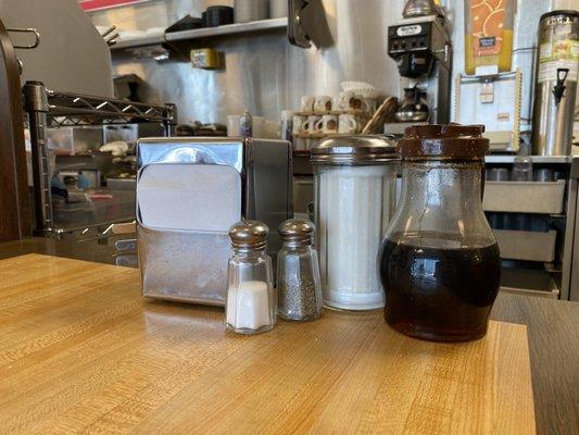 Syrup, sugar, salt, pepper and napkins for your table.