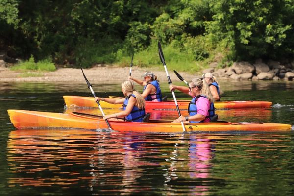 Women's kayak race (kayaks and life jackets provided).