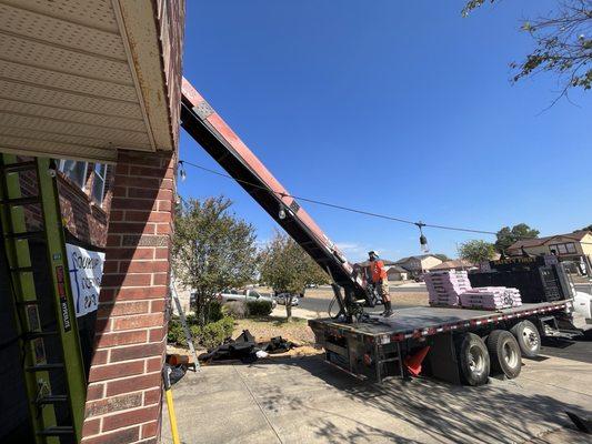 Special lifting truck to get the new shingles on quick and safely.