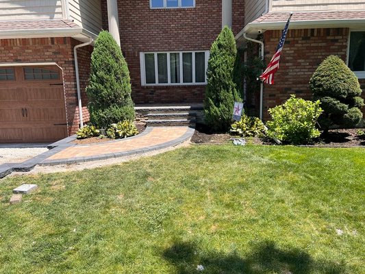 blacktop driveway with belgium block edge and Cambridge armortec paver apron and stoops with veneer stone facing