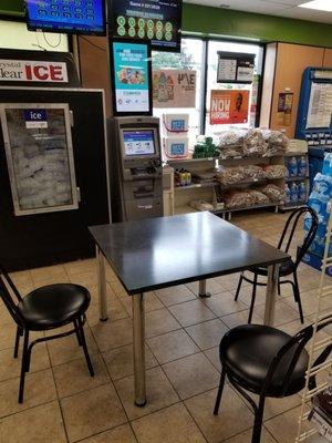 Scratch ticket and lotto table set up right next to ATM.. Gross