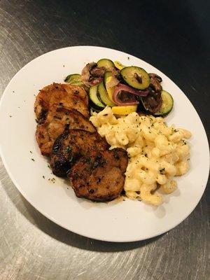 Our pork tenderloin with a side of Mac and cheese and sauteed veggies