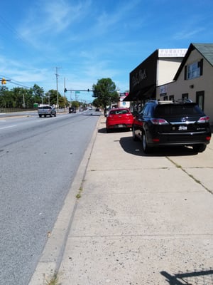 SIDEWALKS ARE FOR PEDESTRIANS. PARK IN PARKING LOT!