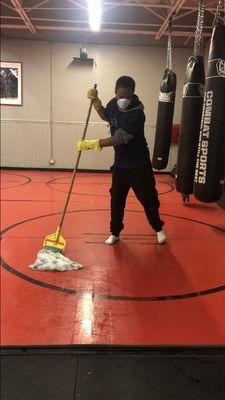 -Cleaner in action mopping mat
-Routine clean at a gym