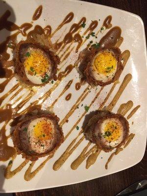 WISCONSIN SCOTCH EGGS Two hard cooked eggs in bratwurst, panko breaded & deep fried. Served with Sprecher mustards and house sauerkraut.