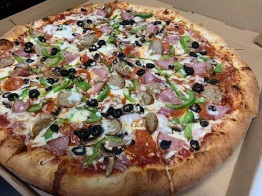 Loaded pizza. Pepperoni,  ham, sausage,  mushrooms,  red onion,  bell peppers,  black olives