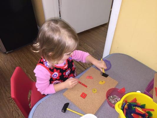 Working hard on fine motor skills.