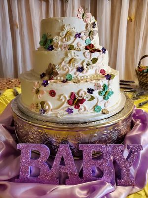 Beautiful baby shower with butterflies cake.