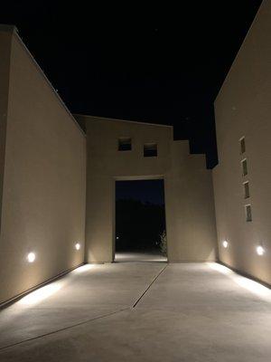 Exterior wall mounted pathway lighting.