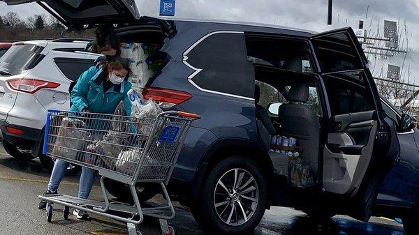 Shopper loading her car