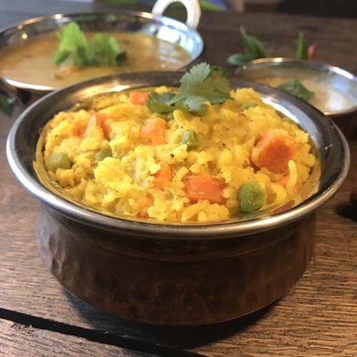 Kitchari Bowl. Traditional rice and lentil dish served with Red Lentil Soup and Coconut Chutney