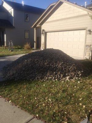 Mountain of rock that was moved to flower beds during the landscaping project of before & after pics.