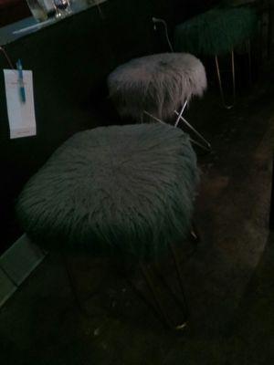 Fur chairs for the hostesses while conversing w/ customers at the bar. $10/person.