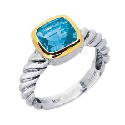 This Blue Topaz sits on top of this Phillip Gabriel Sterling Silver twisted wire ring, that has a nice touch of 18K yellow gold