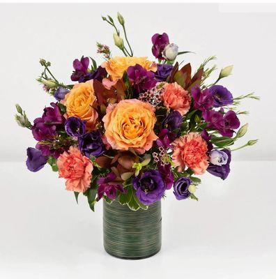 Surprise a loved one with the rich beauty of these roses, lisianthus, and carnations.