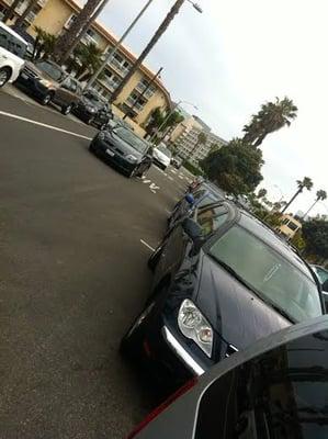 Metered Parking on Ocean Ave., right next to Crescent Bay Park, and right above Race Check-in down by the beach.