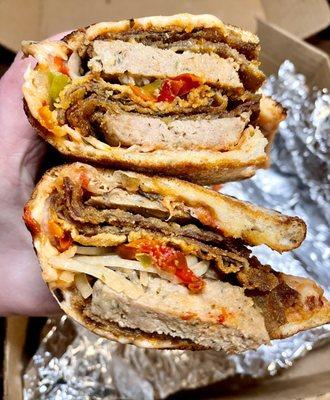 Pizza sandwich-breaded eggplant,meatballs,onions,bell peppers,tomato chunks & cheese in fresh baked, crispy personal pizza crust - awesome!