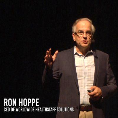 Ron Hoppe, CEO of WorldWide HealthStaff Solutions presenting on stage