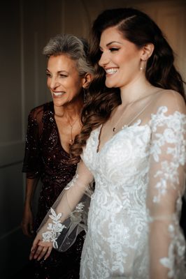 My mom with her new hair checking out my dress on my wedding day.