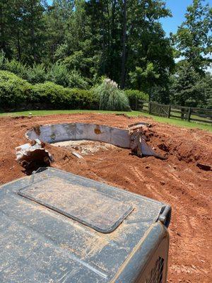 Pool demolition in progress