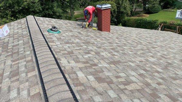 New architectural shingles warrantied by Owens Corning with new chimney cover