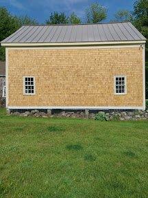 Replaced the old siding with grade A cedar shakes and the trim boards too.