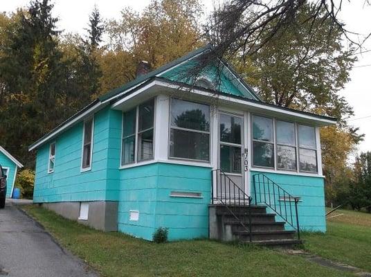 Small four-room bungalow on 1/4 acre.  Nice one-floor living with small bedroom on first floor...