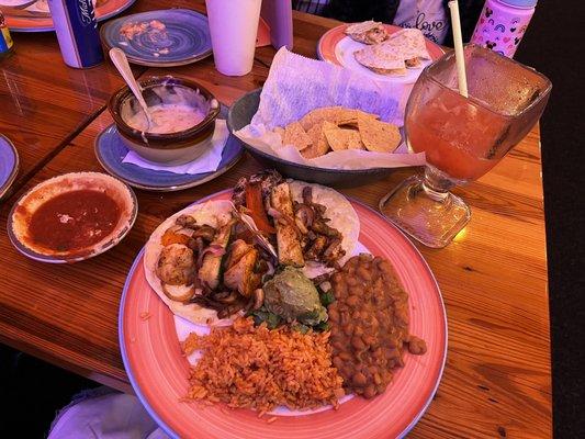 Surf N Turf Fajita Taco Plate on Flour tortillas  Strawberry Pineapple Margarita on the rocks  Corn chips, house salsa & Queso Fundido.