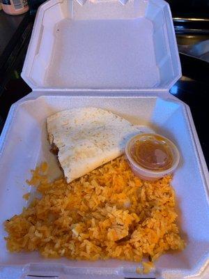 Half of my steak quesadilla and rice. Yummy!