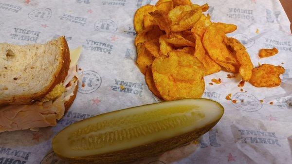 What's left of a Beach Club on wheat, BBQ chips, and pickle