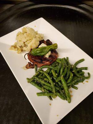 Prime 6oz filet with garlic butter and swishing pepper