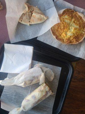 Zaatar manouche (rolled), Spinach pie (Triangle), egg and cheese Lebanese style quiche (circle)