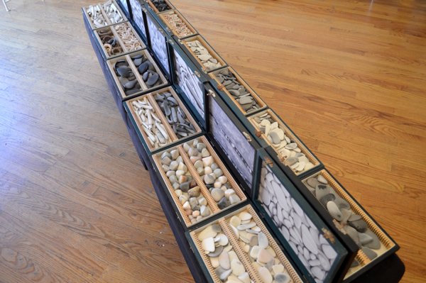 Installation view of "taxonomy of sorts" a mixed media piece made of vintage boxes and tumbled clay pieces.