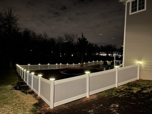 Two tone vinyl fence with wired LED lights