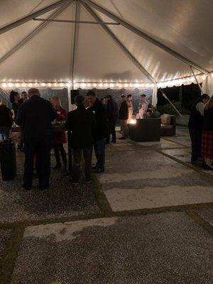 Lighted tent covering their outside patio on this rainy evening for the Oyster Roast!