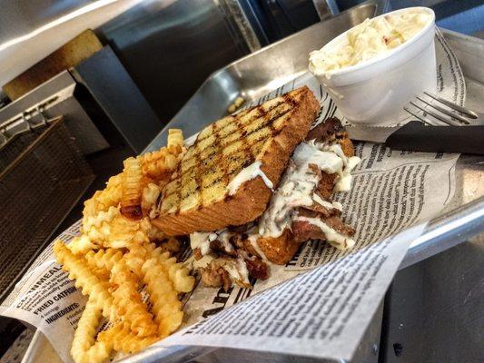 Lil Bit of Texas - Texas toast sandwich with brisket, topped with queso. Combined with French fries and potato salad