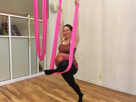 Michelle practicing flying pigeon, a shape that stretches the front of the back leg, and the piriformis, helping with sciatica.