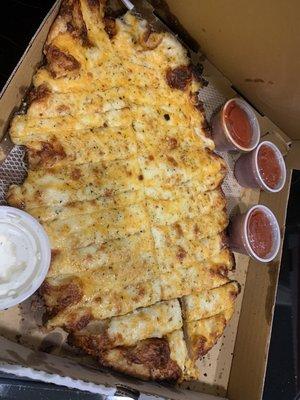 Full order of cheese bread and marinara sauce.