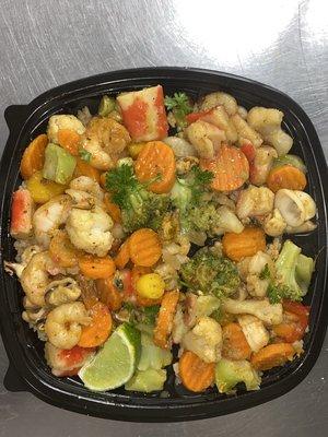 Order our delicious Seafood Medley! A mix of your favorite seafood and veggies sautéed in a delicious Caribbean seasoning!