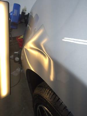 Dent on a bodyline (crease) of a Fender