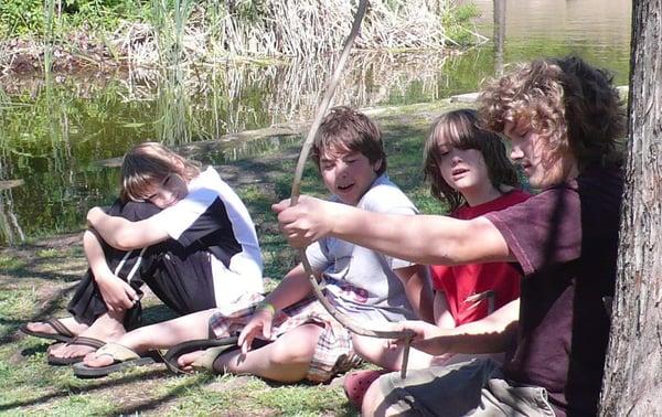 Students playing and talking at the park.