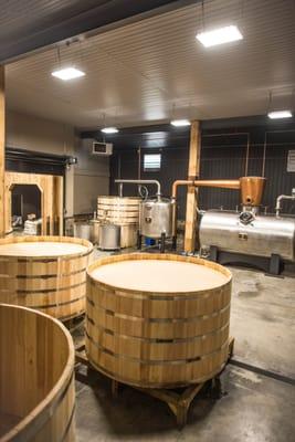 Inside the distillery production room.  Open wood fermentation tanks and The Bull, our 2,100 gallon still.