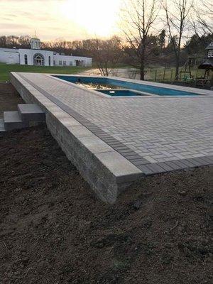 This pool deck and retaining walls look beautiful