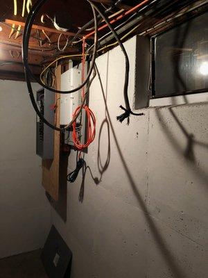 A live 220 volt cable left dangling in a small corridor in my basement