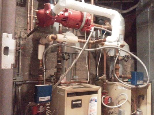 This system was over sized, piped wrong, had an incorrect combustion air supply method, and improper control setup...